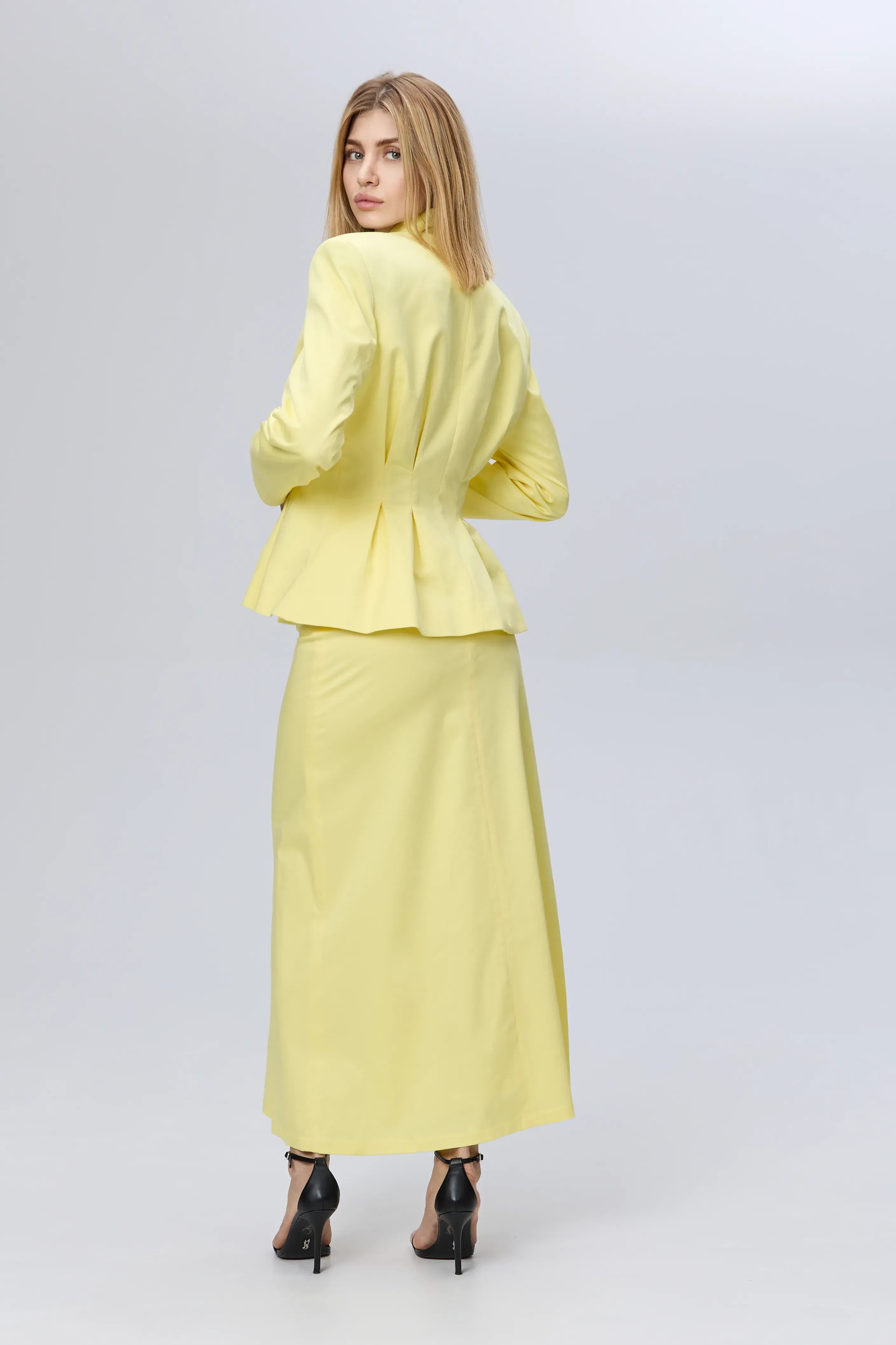 Elegant suit and yellow skirt